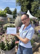 Libby Stubbs with BGCs' 4 Flower Award at RHS Hampton Court Palace Garden Festival