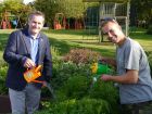 Greenfingers Chairman Matthew Wilson, and garden designer Matthew Eden help water the latest Greenfi
