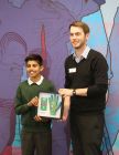 Briers’ Head of Design, Lewis, presents Aidan with the finished product in front of his school.